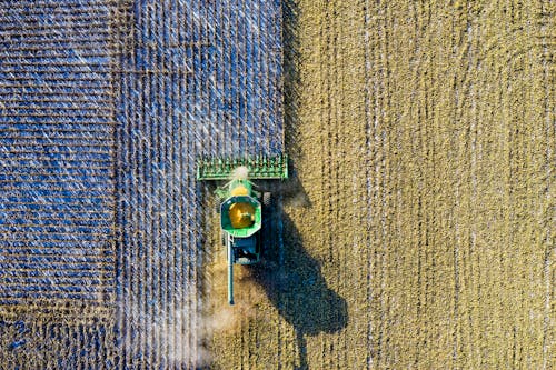 Free Aerial Shot of Green Milling Tractor Stock Photo