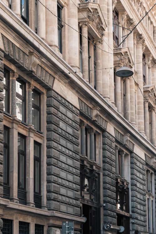 Free A detailed view of a historic building facade showcasing classic architecture and vintage charm. Stock Photo