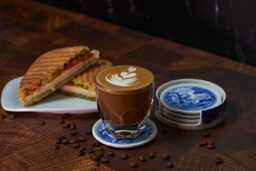 A Cup of Coffee with Latte Art and a Toasted Sandwich 