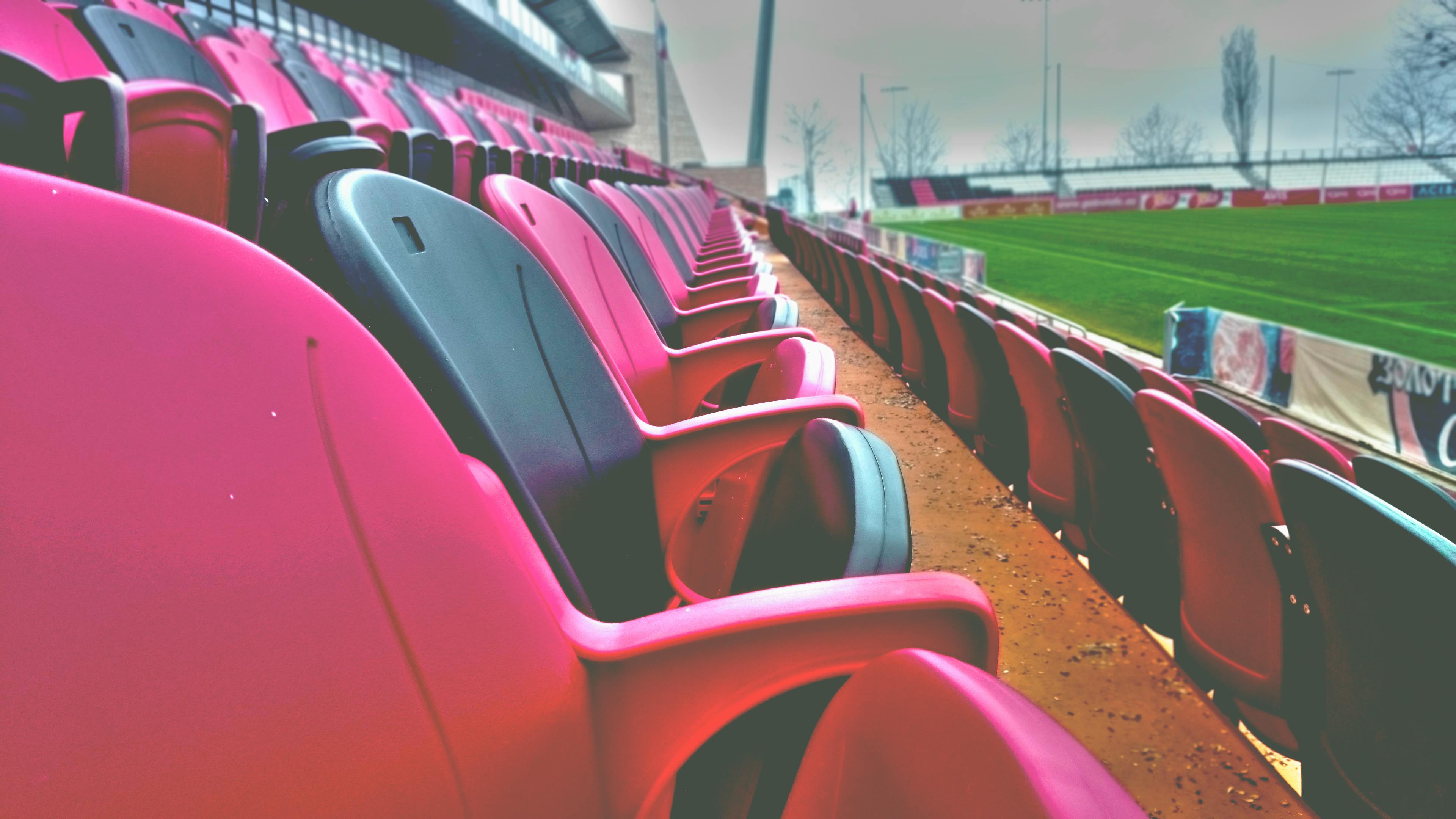 empty sports stadium seats during day