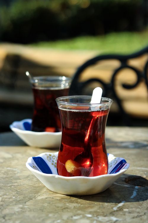 Free Two glasses of Turkish tea on a table in sunny Bursa, Türkiye, showcasing local culture. Stock Photo