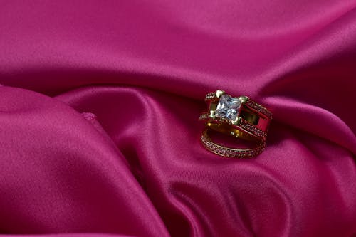 Close-up of a Ring on a Pink Silk Fabric 