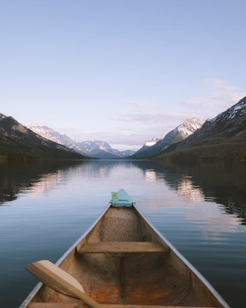 Wooden Boat on Lake in Mountains