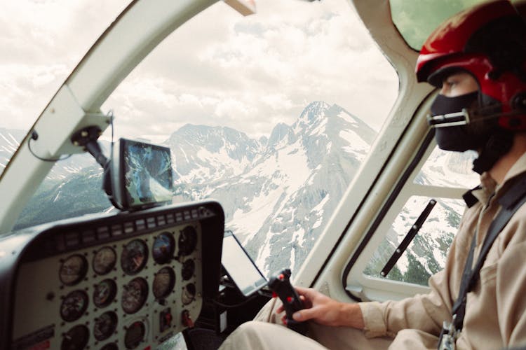 Pilot Sitting On Airplane