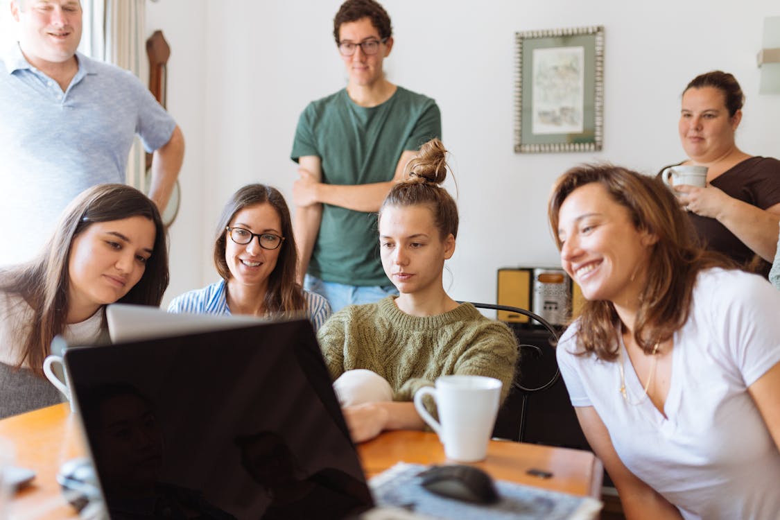 Free People Looking at Laptop Computer Stock Photo