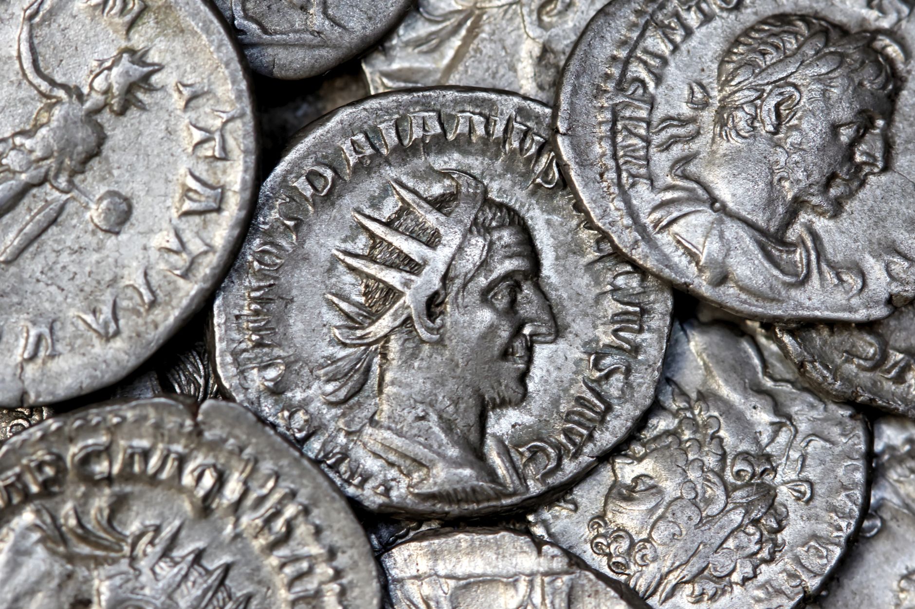 Close-up view of ancient Roman silver coins showcasing detailed engravings and historical significance.