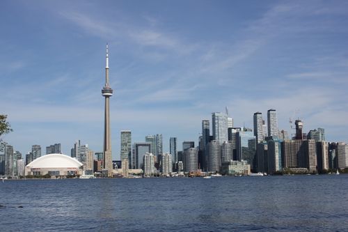 Free Panoramic view of Toronto skyline featuring CN Tower and Lake Ontario. Stock Photo