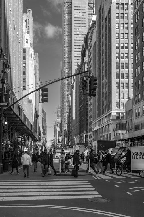 People Walking in City in Black and White