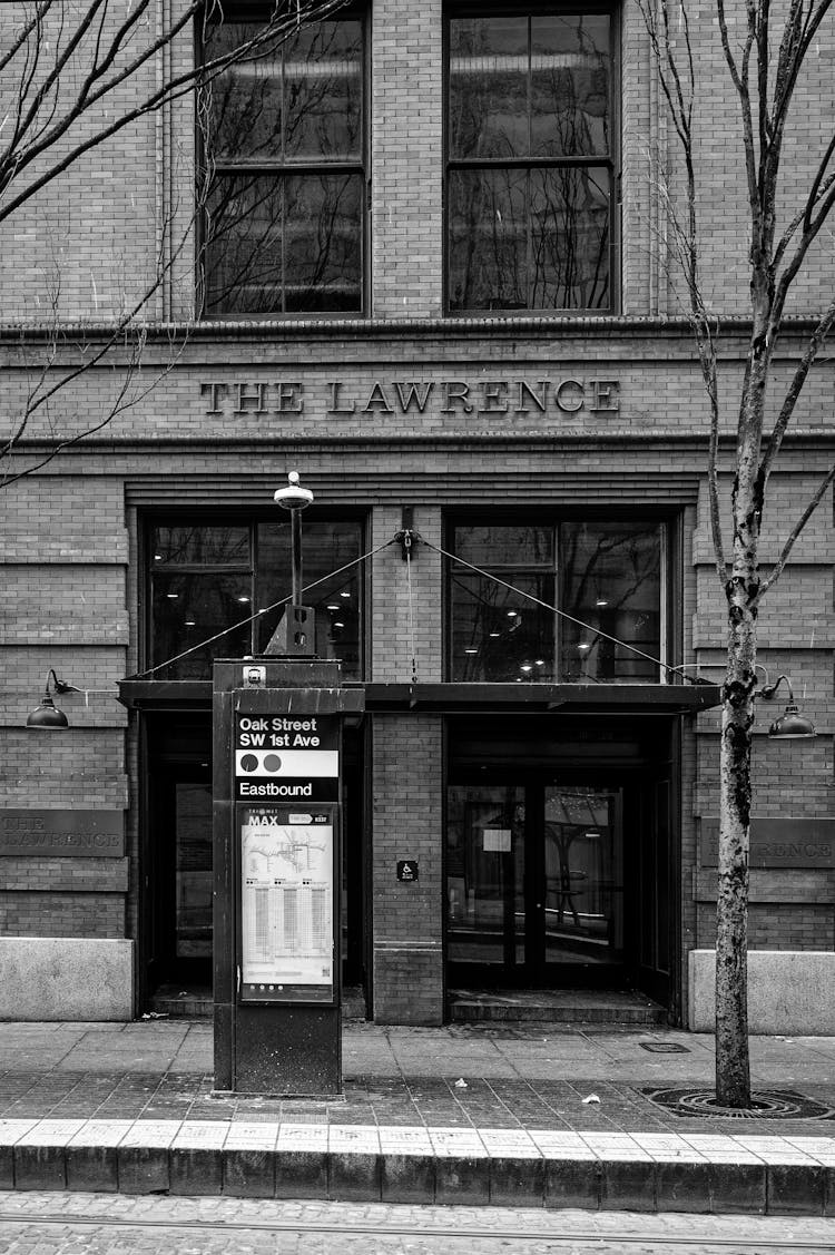 Bus Stop And The Lawrence Text On Wall