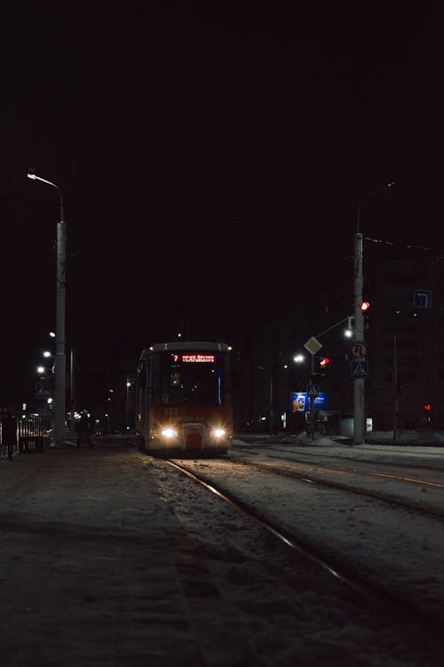 A Tram on the Street in City at Night 