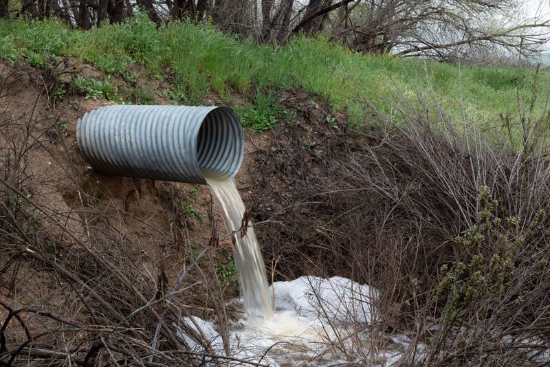 Outflow pipe on a shoreline — photo by Joseph Russo on Pexels