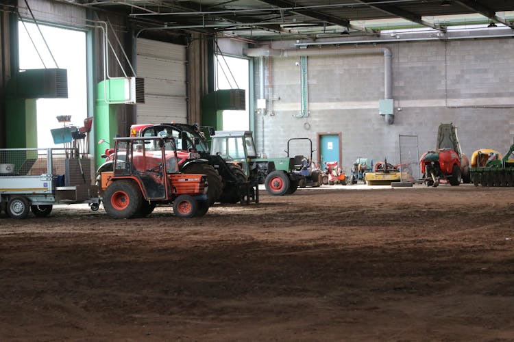 Tractors In Farm Building