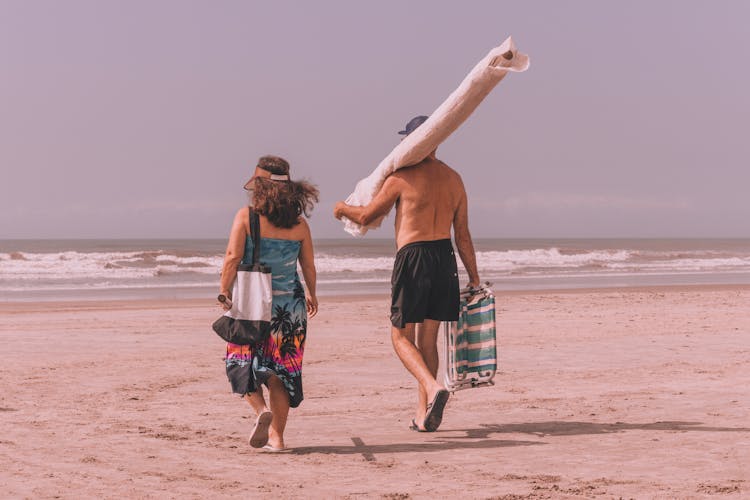 Couple Walking On Beach