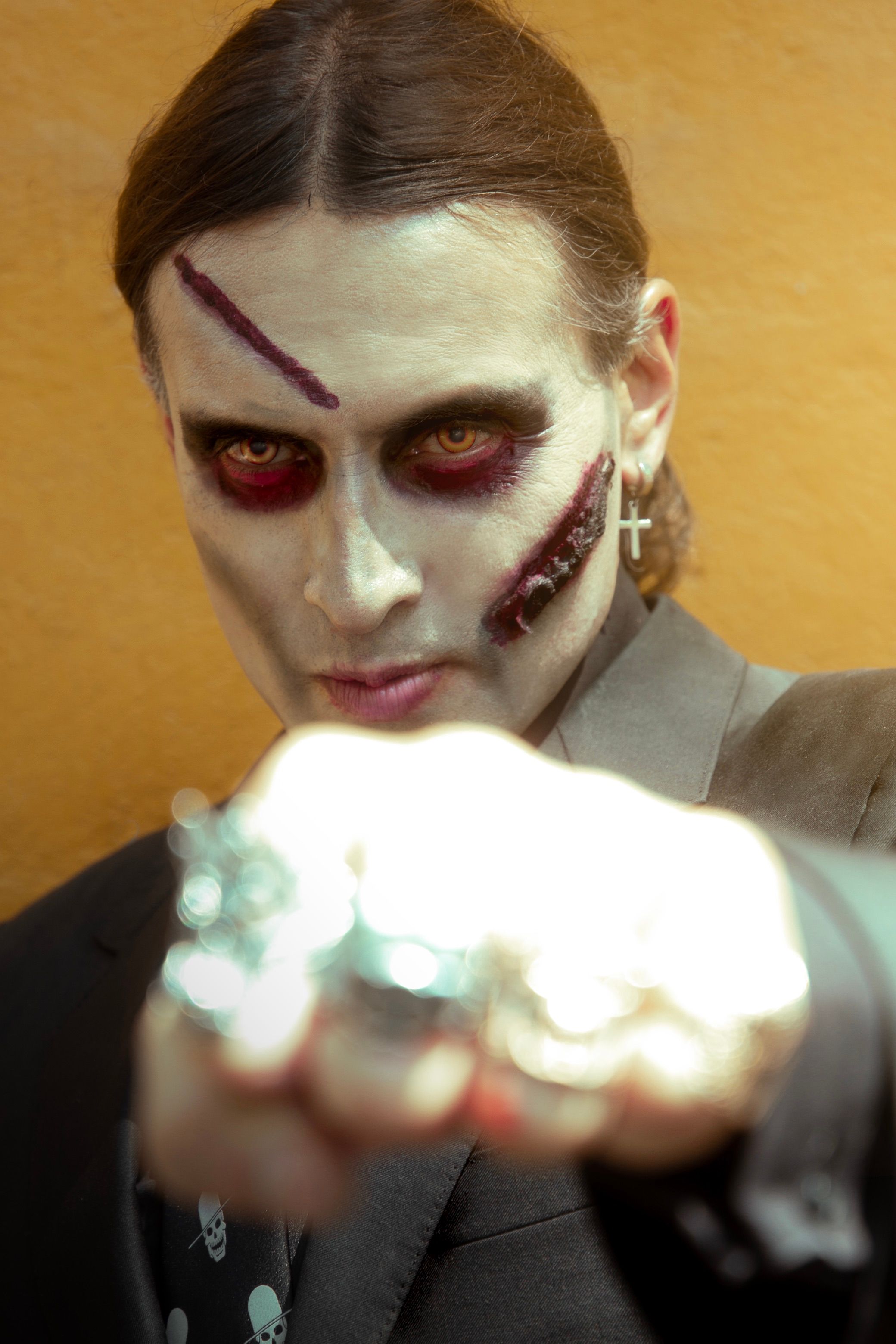 Portrait of Man Wearing Fake Wounds Makeup