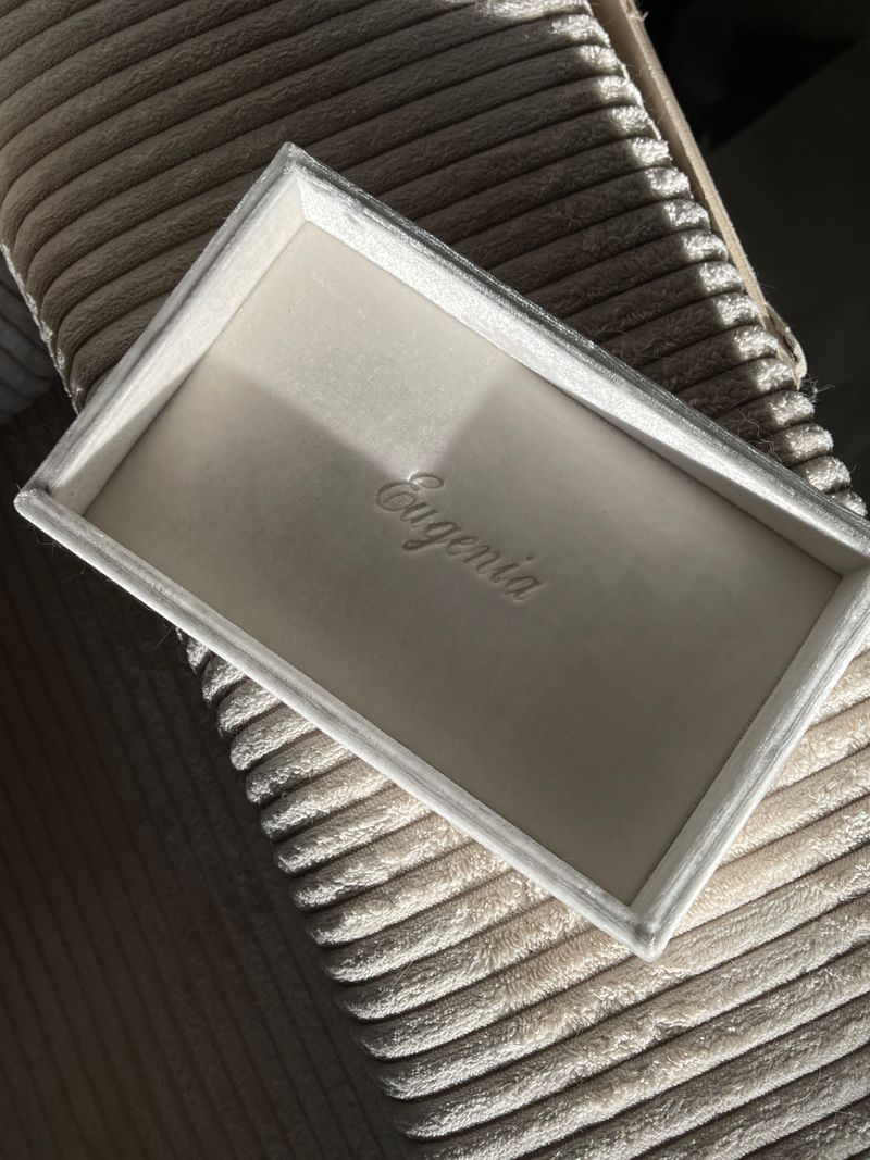 Elegant open velvet box with branding, perfect for jewelry packaging