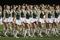 Group of Cheerleader on Green Field