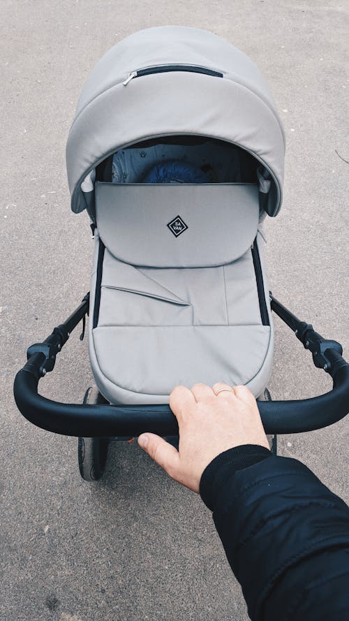 Man Pushing a Stroller