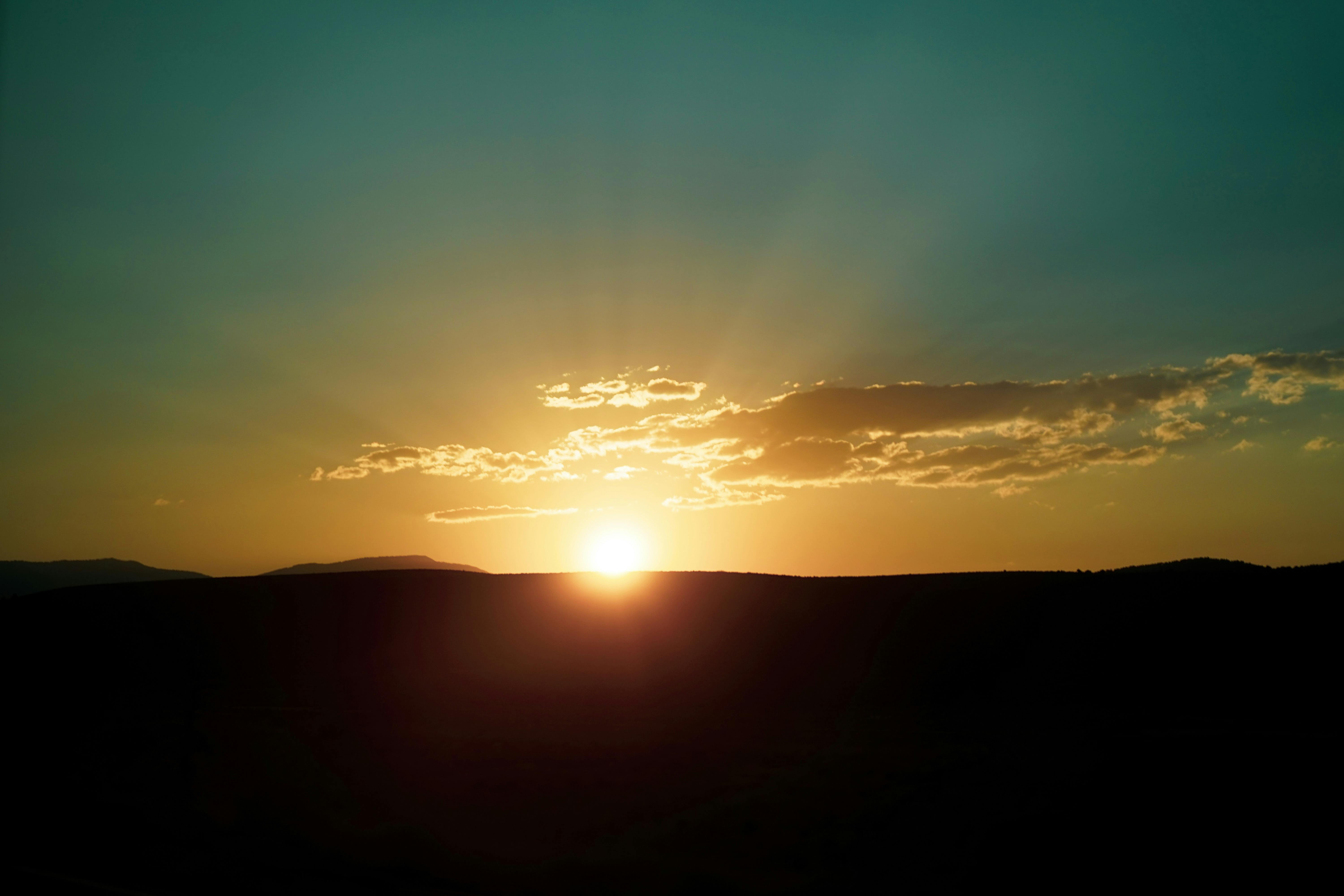 Crowds celebrating at night with colorful lights on a city street