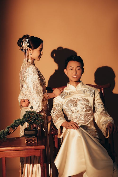 Bride and Groom Wearing Traditional Wedding Clothing 