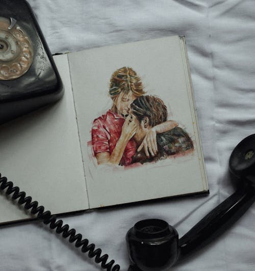 A drawing of a woman and a man on a bed with a phone