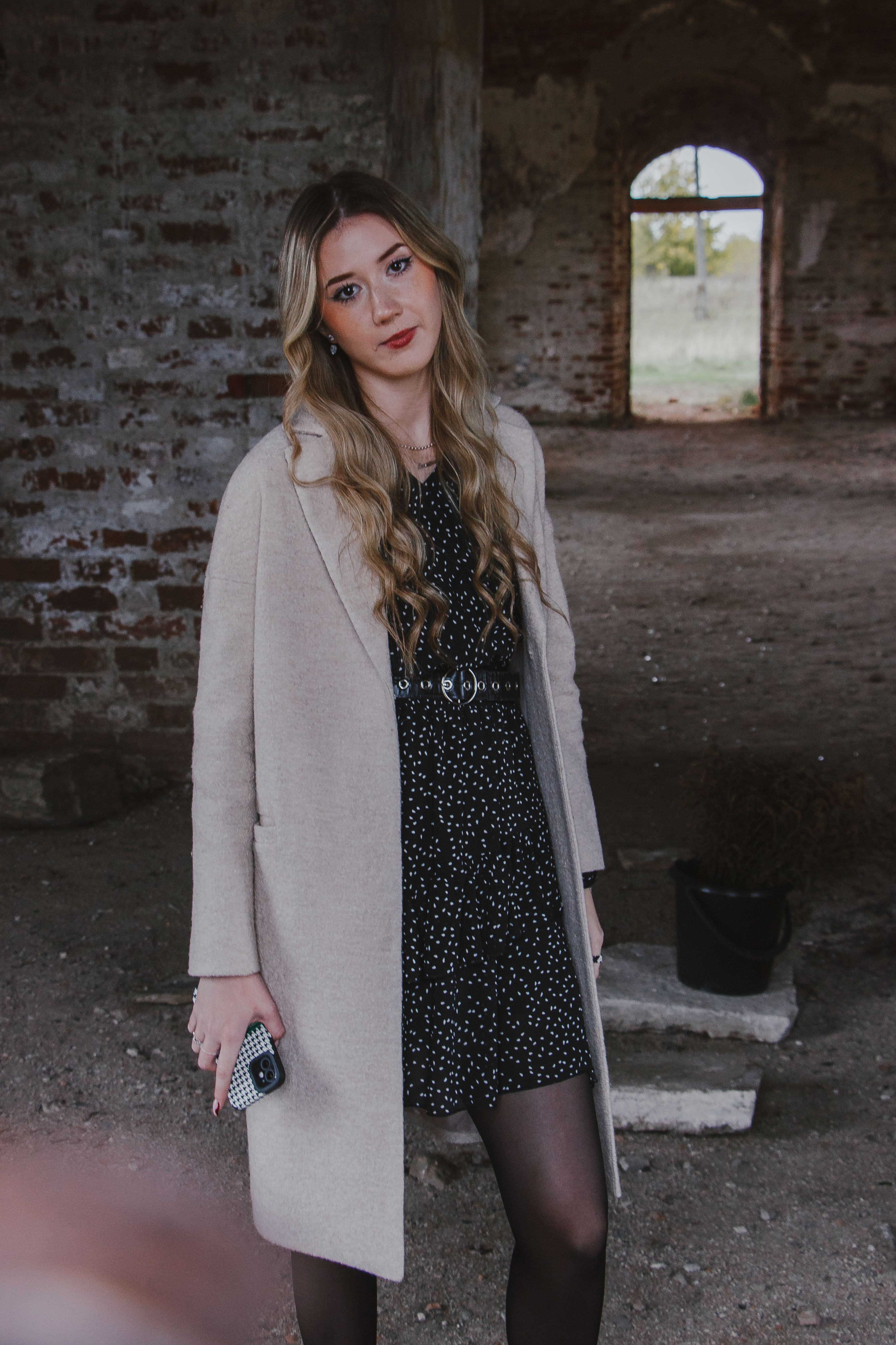 Model Posing in Dress and Coat · Free Stock Photo