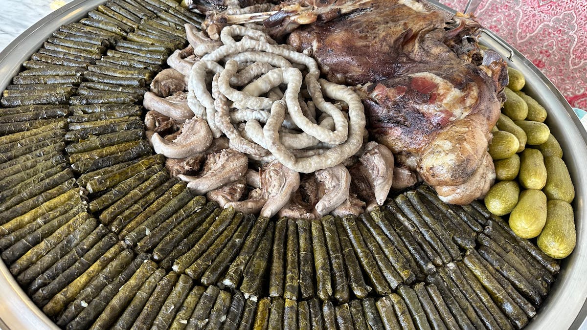 Cricket coach talking with players near the boundary line