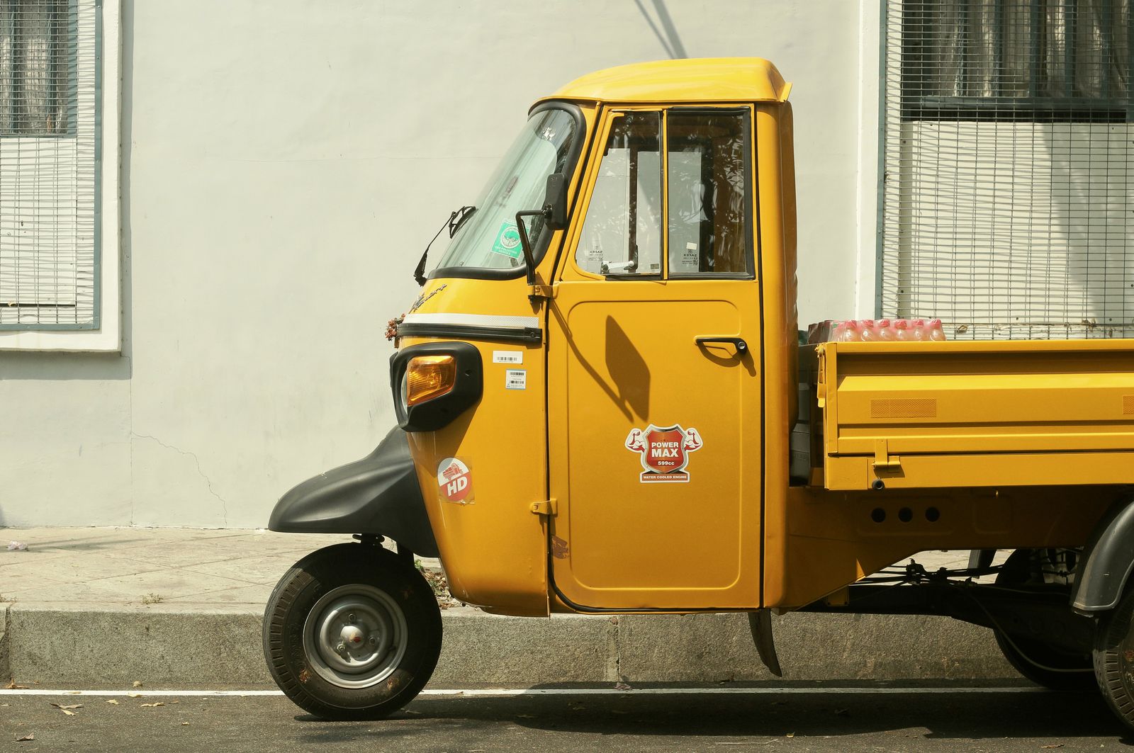 Piaggio Ape three-wheeler on an Indian road