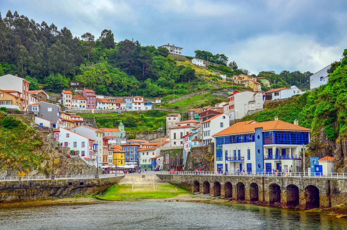 Coastal cliffs and harbor of a fishing village in Asturias