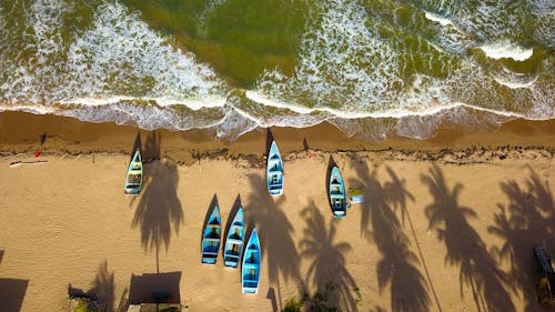 Boats on Sunlit Beach