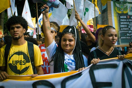 A Group of Young People on a Protest on a City Street 