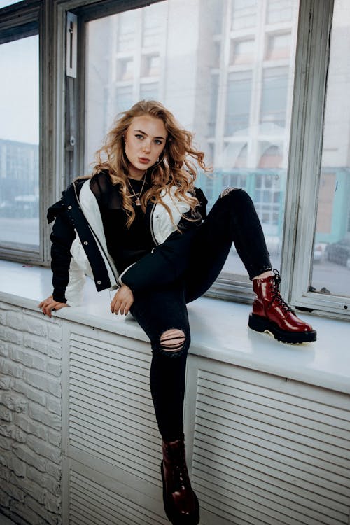 Young Model Posing Sitting on a Window