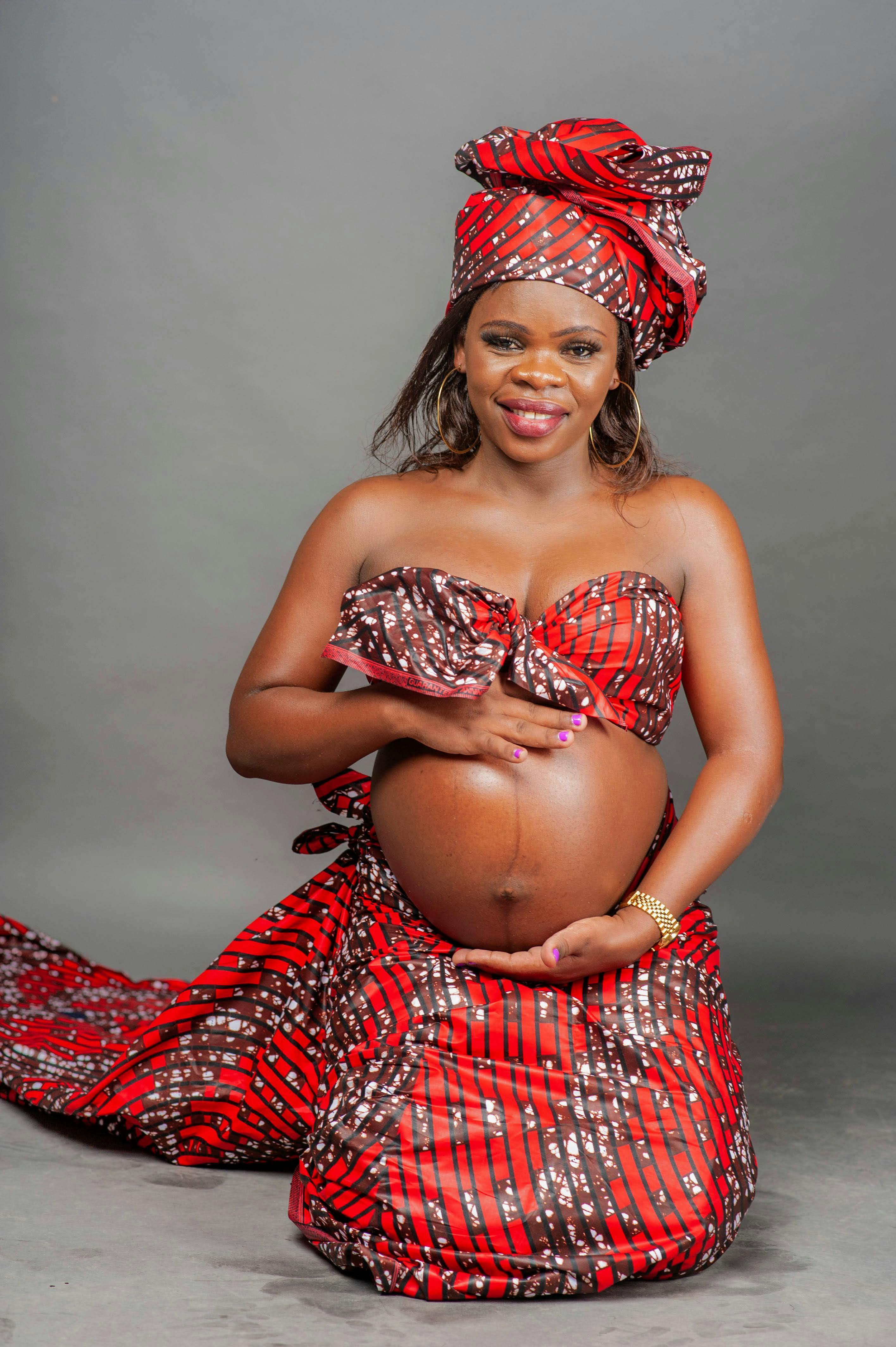 pregnant woman posing in traditional clothing