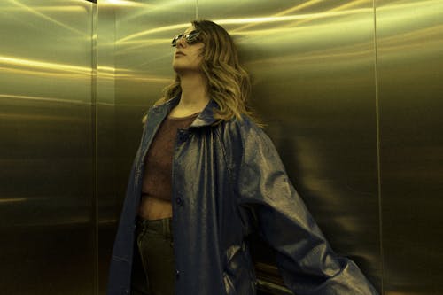 Woman in Sunglasses in Elevator