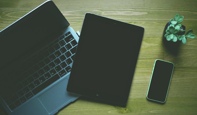 Black Ipad Beside Green Iphone 5c