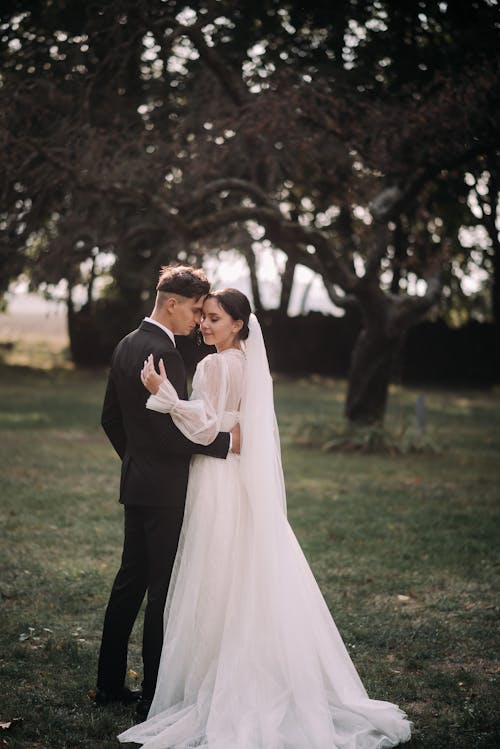 Bride and Groom Hugging Outdoors