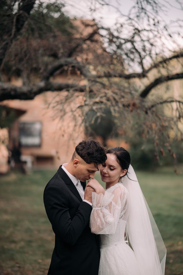 Newlyweds Kissing Together