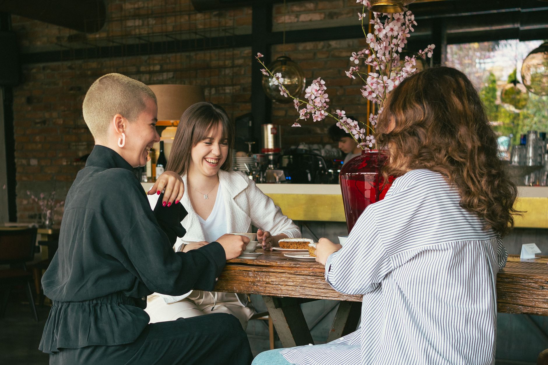 Friends enjoying drinks and conversation together