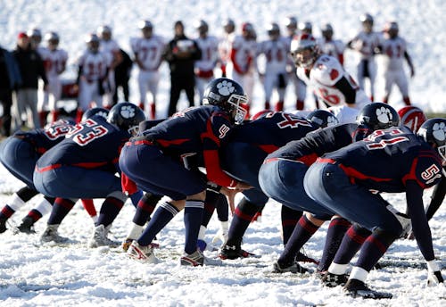 Football Team on Ice during Daytime