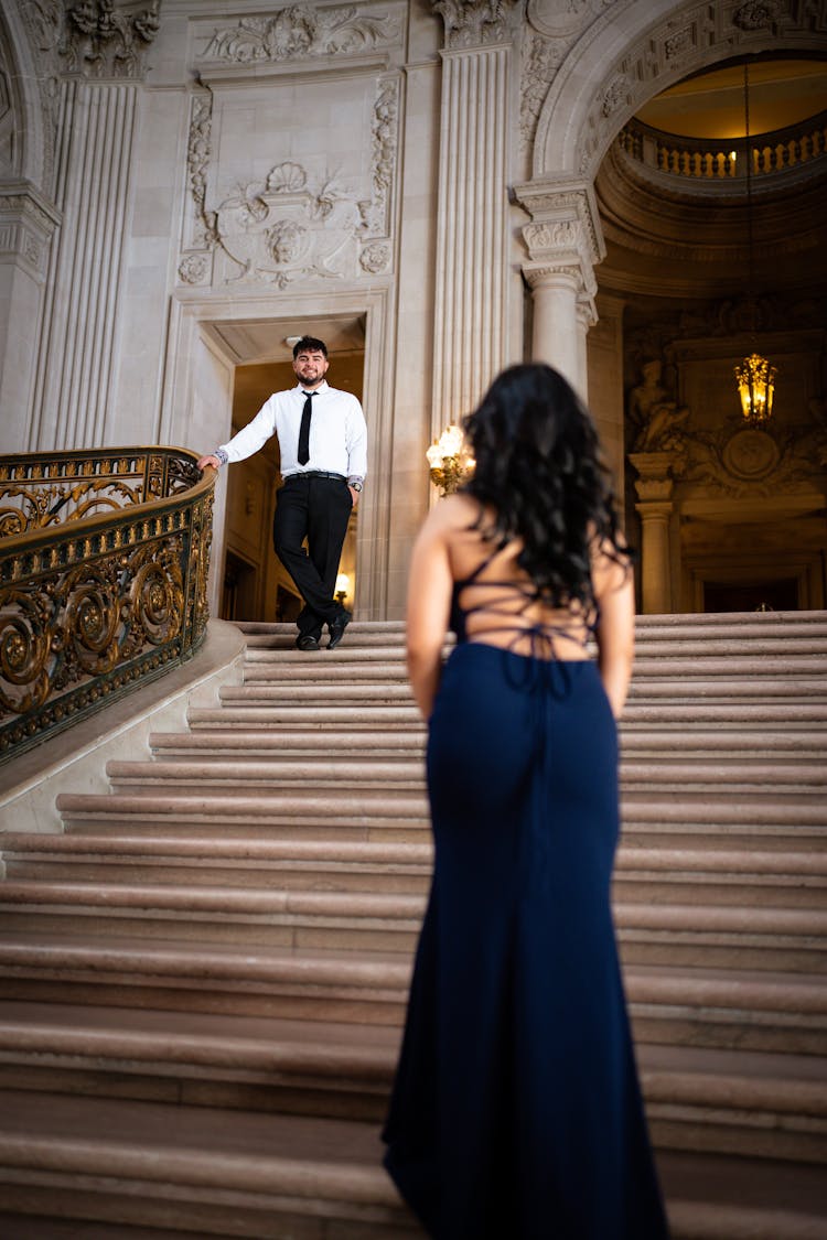 Woman Walking Up The Stairs To Meet Her Partner 