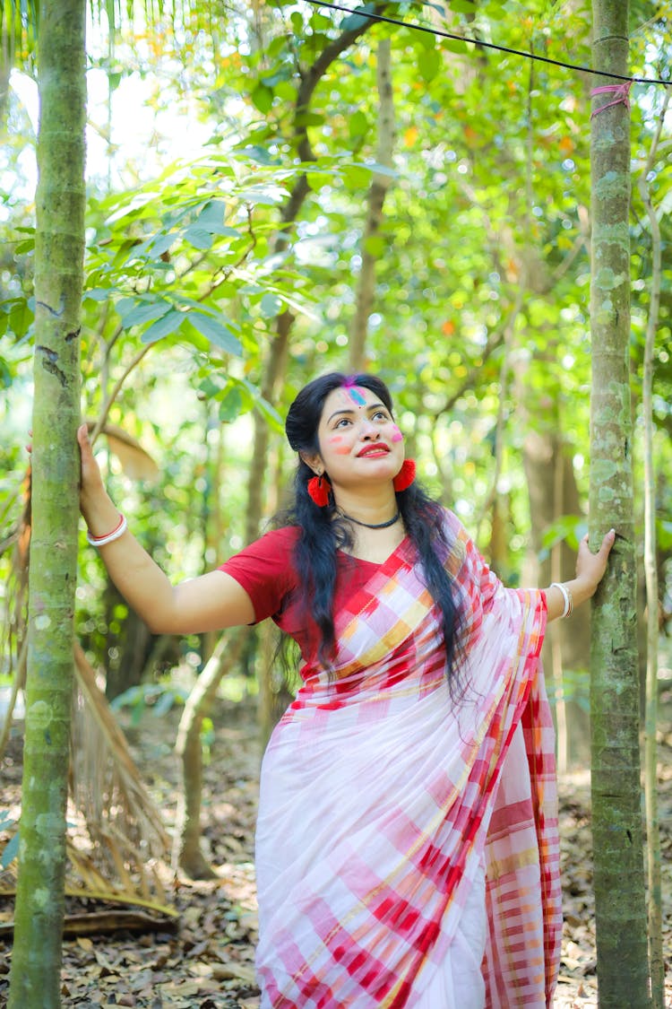 A Woman In A Traditional Dress In The Forest