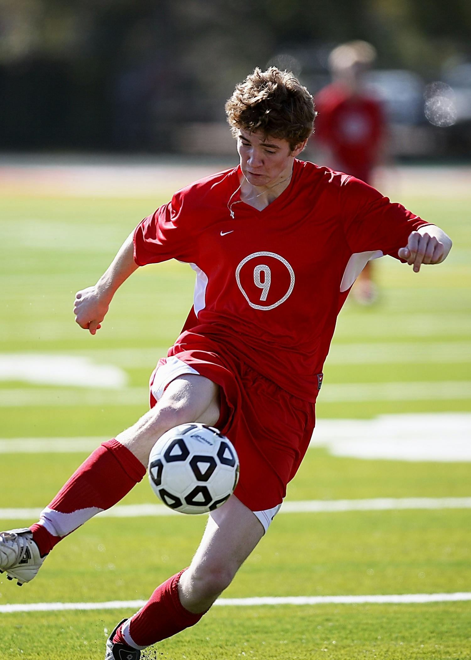 Football Soccer Player is Number One in a Stadium Background Stock