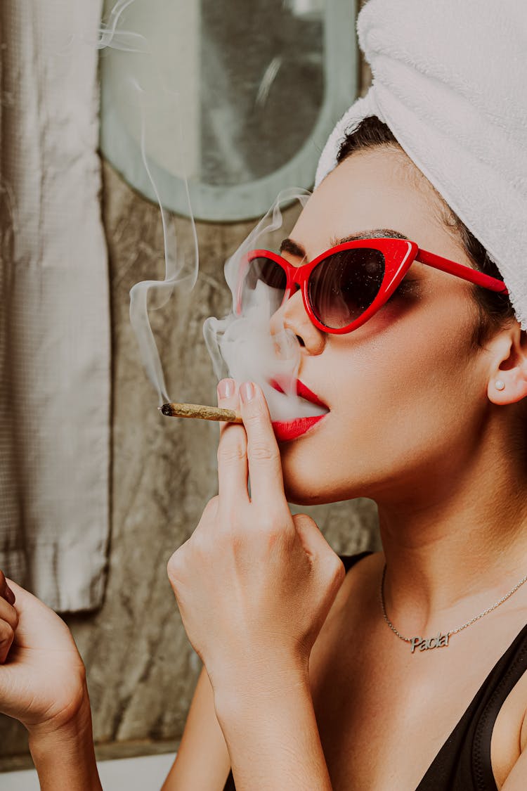 Woman In Sunglasses Smoking Cigarette