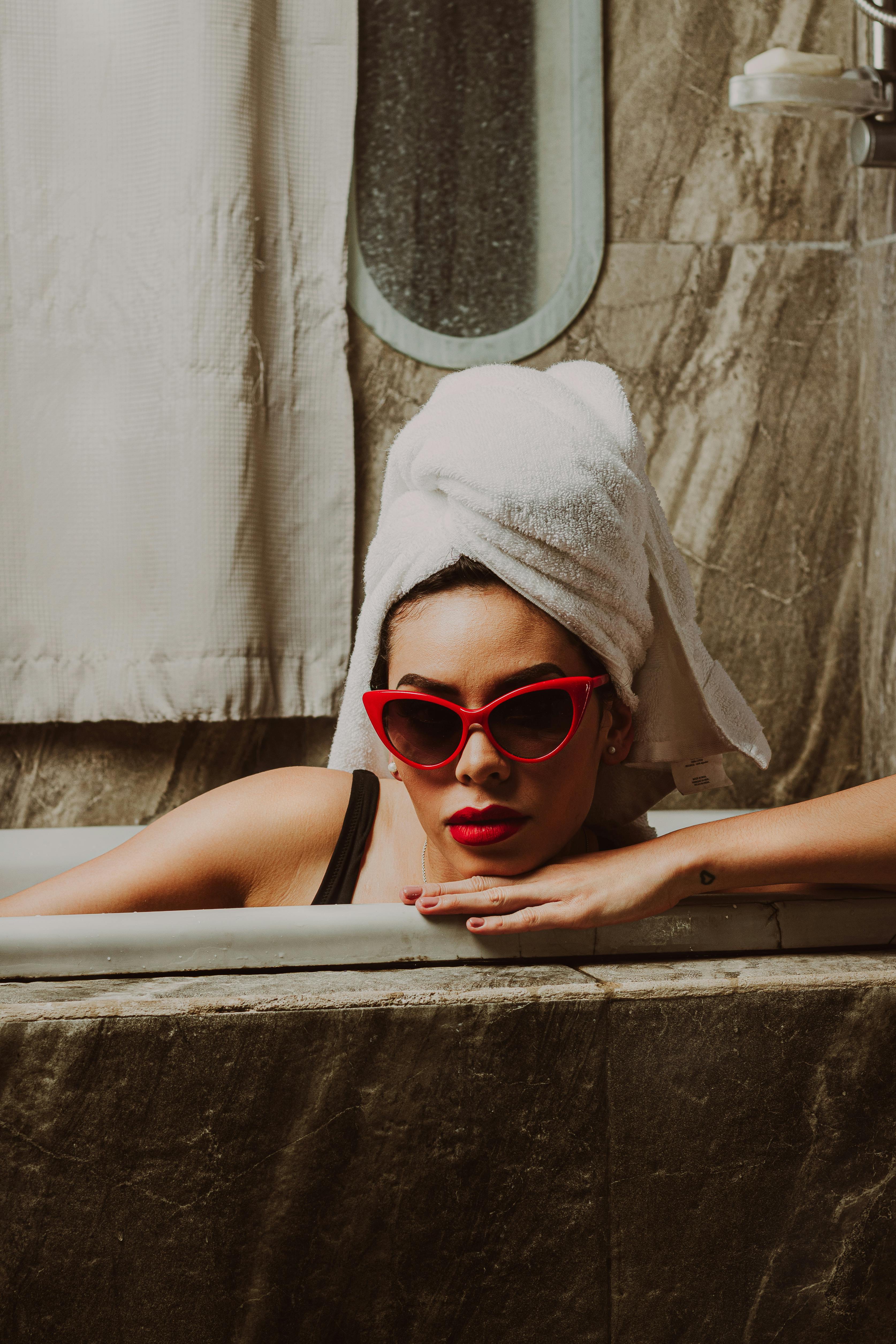 Two Naked Women Inside a Bathtub with Head Towels · Free Stock Photo