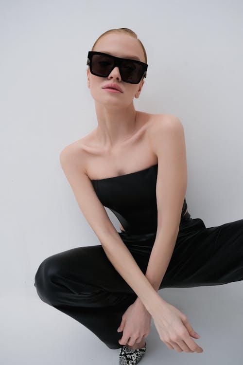 Woman in Sunglasses Crouching and Posing
