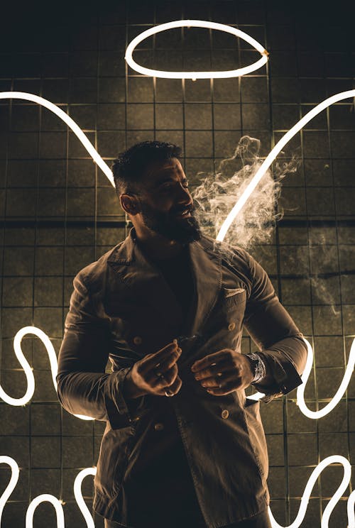 Neon Angel Wings and Aureole over Man in Suit