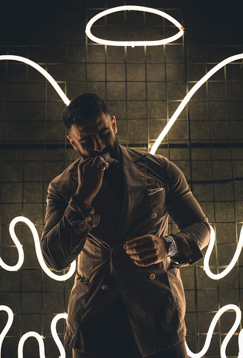 Neon Angel Wings and Aureole over Man in Suit
