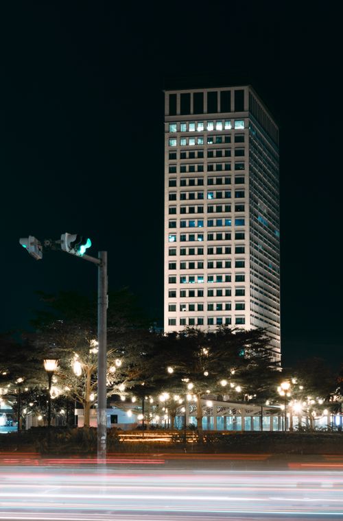 Free Captivating nighttime view of a lit skyscraper in Phnom Penh, Cambodia. Stock Photo