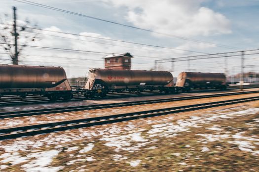 Blurred motion of a freight train passing through Trzebinia, Poland.