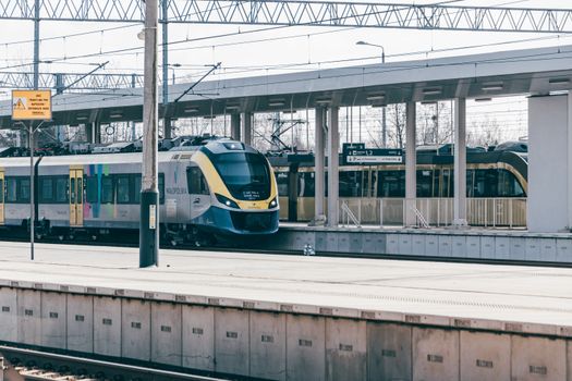 A passenger train at Trzebinia station in Poland, showcasing contemporary public transport.