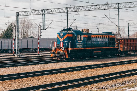 Locomotive on railway tracks in Trzebinia, Poland showcasing industrial transportation infrastructure.